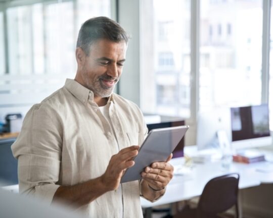 man using pay and trace automation software on tablet
